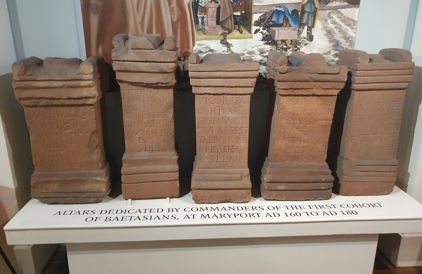 Roman altars found at Maryport, and house in the Senhouse Roman Museum 