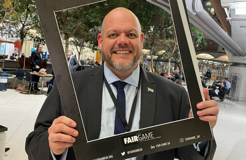 Mark Jenkinson with Fair Game placard 