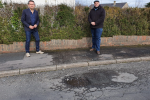 Mark Jenkinson and Councillor Colin Sharpe with pothole