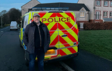 Mark with police van