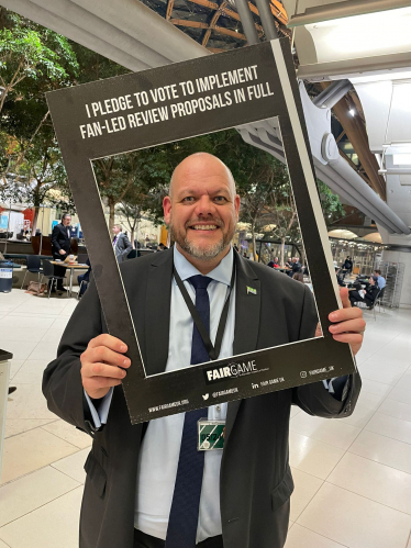 Mark Jenkinson with Fair Game placard 